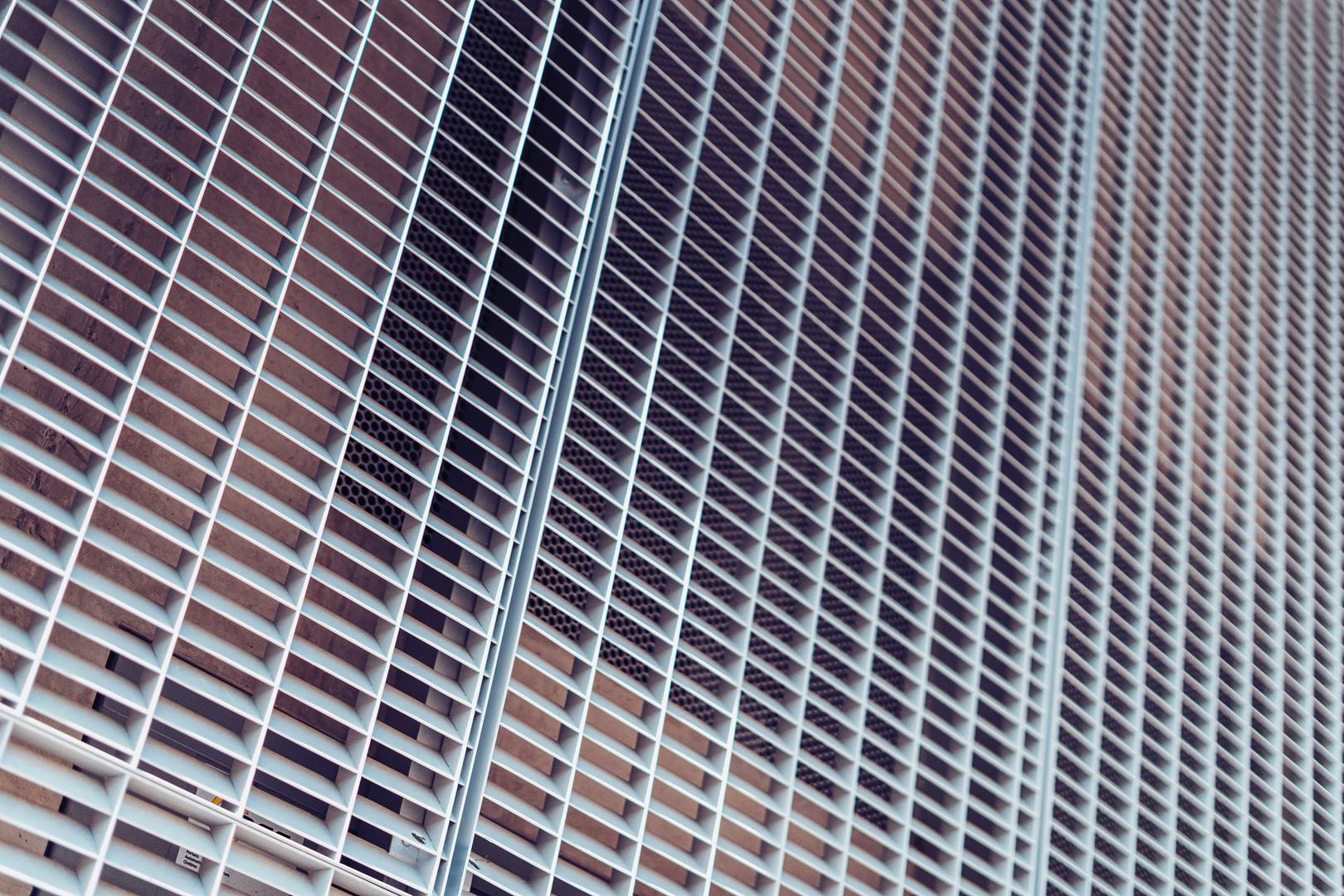 Gray metal grid background.Gray metall wall